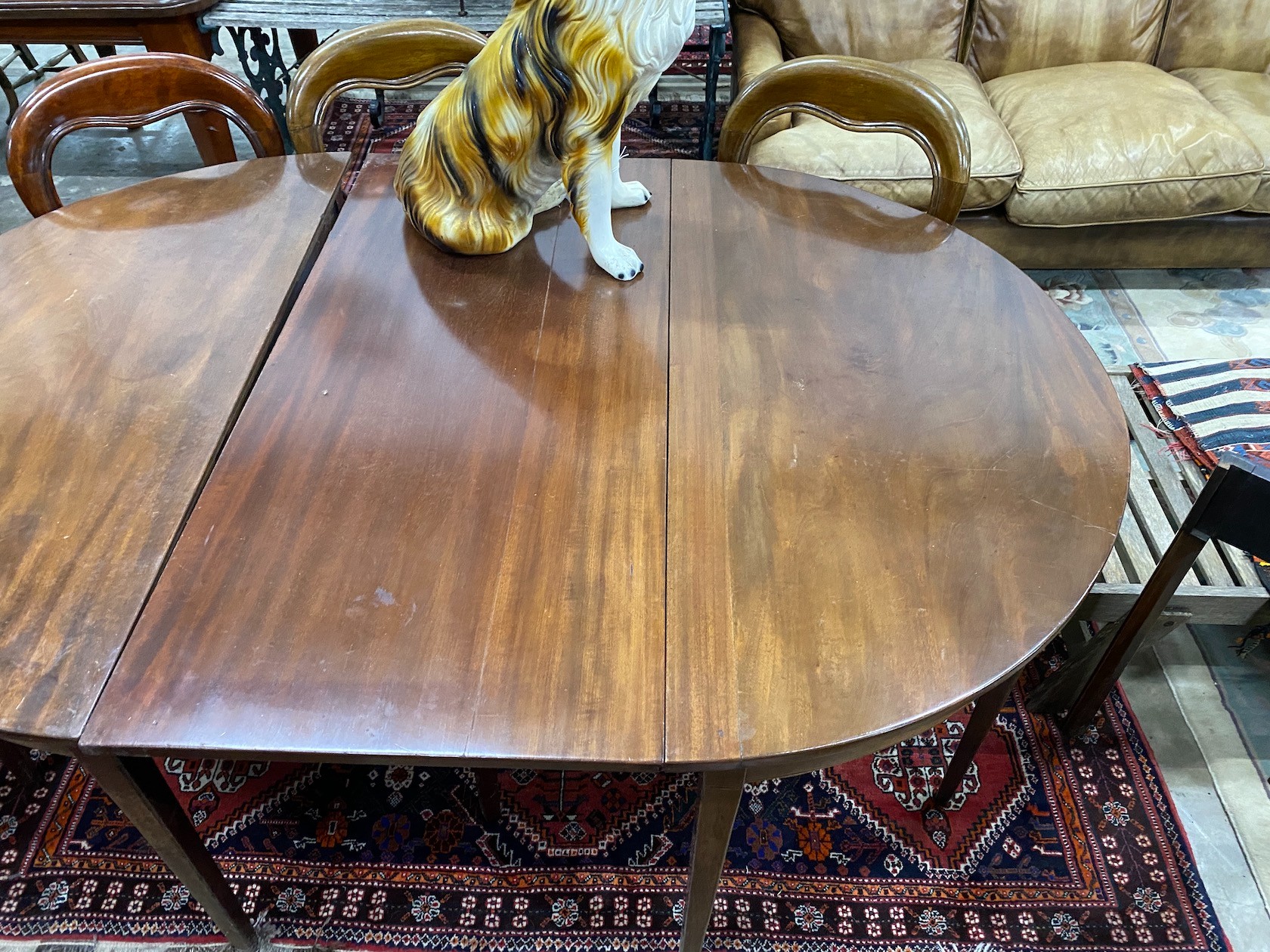 A George III mahogany D end extending dining table with later drop leaf, 180cm extended, depth 127cm, height 74cm